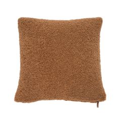 a brown pillow that is made out of shaggy fabric and has a wooden handle on the side