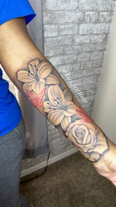 a person with a flower tattoo on their arm