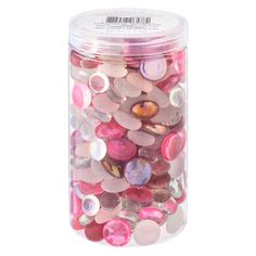 a jar filled with lots of pink and white buttons