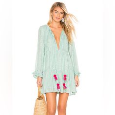 This Neo Short Tiered Mini Dress From Sundress For Revolve In Petra Aqua (A Gorgeous Mint Green) Features Subtle Gold Threads And Sequins Throughout With Long Sleeves, Ruffled Cuffs, A Split Neck With Two Hot Pink Pom Pom Tassel Trimmed Ties, Empire Waist, And Tiered Skirt. Lined. 100% Viscose Made In India Size M/L New With Tags Sundress From Revolve Offers Welcome/Bundle And Save Pink Sundress, Aqua Dress, Panama City Beach, Girl Day, Revolve Clothing, Style Expert, Ladies Dress Design, Fashion Help, Empire Waist