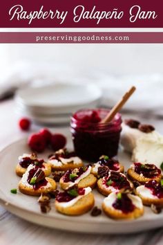 raspberry jalapeno jam on a plate with crackers