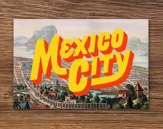 an old postcard with the word mexico city in yellow and orange on top of it