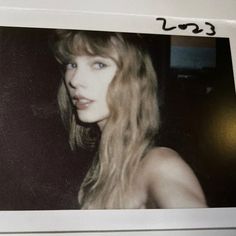 a polaroid photo of a woman with long blonde hair and blue eyes, taken in the early 1960s