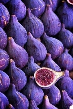 a pile of purple figs sitting next to each other