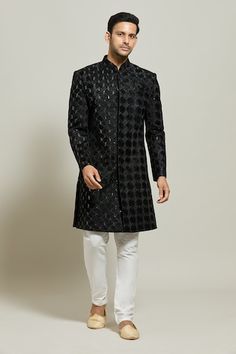 Black sherwani featuring all over geometric pattern embroidery in thread and sequin work. Paired with a white churidar. - Aza Fashions Formal Bandhgala With Mirror Work, Designer Kurta With Mirror Work For Festive Occasions, Designer Festive Kurta With Mirror Work, Festive Designer Kurta With Chikankari Embroidery, Formal Sherwani With Mirror Work, Designer Straight Kurta With Mirror Work, Designer Kurta With Mirror Work For Eid, Designer Eid Kurta With Mirror Work, Designer Mirror Work Kurta For Diwali