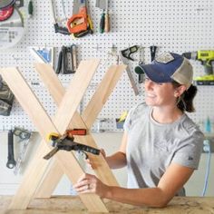 a woman working on a piece of wood