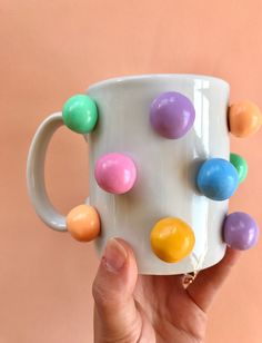 Hand-decorated coffee mug. Please hand wash and do not microwave. This cheerful mug features colorful 3d designs, see the dropdown for options. Rainbows, mushrooms, smiley flowers, retro rainbow swirls, etc! This handmade coffee mug is the perfect statement piece for a happy kitchen, adding colorful vibes. Perfect gift for coffee mug collectors or coffee lovers alike. | Colorful 3D Coffee Mug, Handmade Ceramic Mug, Rainbow Mug, Modern Happy Coffee Lover Gift, Mushroom Mug, Cute Coffee Mugs, Cera 3d Coffee, Rainbow Mug, Polymer Clay Gifts, Pottery Inspo, Mugs Ceramic, Happy Coffee, Diy Mugs, Mug Handmade, Coffee Lover Gift