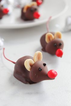 chocolate mouses with red noses on white plates