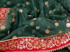 Dark Green Net Dupatta With Red Zari Embroidered Border| Wedding Dupatta | Nikah Dupatta| Indian Bridal Dupatta | Fast Shipping Fabric: Net Work : Thread, Sequins, Zari, Pearl, Beads Accessory: Stone Pattern: All over Sequins Zari embroidery. Color : Dark Green color Border: Red Zari Embroidered Lace Boundary: Four sided Golden Pearl Lace Border Color: Red Length : 2.24 m Width : 1.10 m Border:7 cm Weight:320 Gm Care: Dry clean only. Product color may slightly vary due to photographic lighting s Indian Bridal Dupatta, Nikah Dupatta, Wedding Dupatta, Bridal Dupatta, Pearl Lace, Zari Embroidery, Golden Pearl, Light Salmon, Sanaya Irani