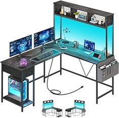 a computer desk with three monitors and two laptops sitting on it's sides