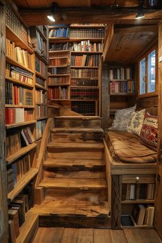 a wooden staircase leading to a bookshelf filled with lots of books