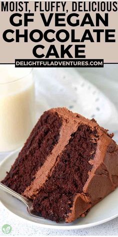 a piece of chocolate cake on a white plate with a glass of milk in the background