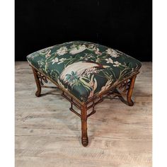 a foot stool sitting on top of a hard wood floor