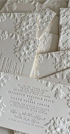 some white cards with intricate designs on them