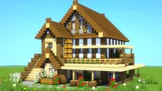 a very nice looking house made out of wood and bricks in the middle of some grass