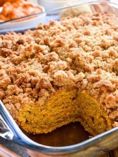 a close up of a cake in a pan on a table with other food items