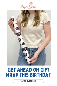 a woman holding a wrapped gift in her hand with the caption get ahead on gift wrap this birthday tap to customize