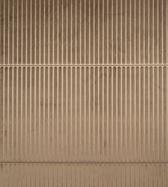 an overhead view of a brown wall with vertical lines in the center and one line at the bottom