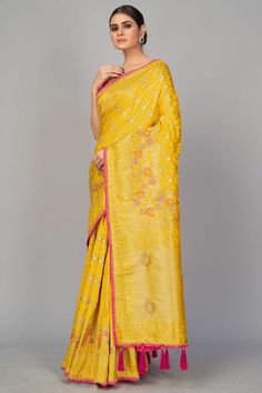 Monjolika fashion presents look simple and sober in festive event and function with this stunning yellow color designer saree. This party wear pure viscose dola silk saree is decorated with fancy woven embroidery work. The saree comes along with matching rani pink color banarasi dupion silk heavy work unstitched blouse piece that can be custom tailored upto 42 inches. Product Features: Saree Color: Yellow Blouse Color: Magenta Saree Fabric: Art Silk Blouse Fabric: Art Silk Saree Work: Woven Blou Yellow Pre-draped Saree With Resham Embroidery, Yellow Resham Embroidered Pre-draped Saree For Festivals, Yellow Semi-stitched Pre-draped Saree With Resham Embroidery, Yellow Pre-draped Saree With Zari Work, Yellow Pre-draped Saree With Resham Embroidery For Navratri, Yellow Pre-draped Saree With Resham Embroidery For Festive, Yellow Pre-draped Saree With Resham Embroidery For Festive Occasions, Festive Yellow Pre-draped Saree With Resham Embroidery, Yellow Chanderi Pre-draped Saree With Resham Embroidery