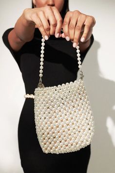 We are obsessing over pearls right now and this bag is everything we are loving. Featuring white pearls in a tube shape with a mini grab handle, what's not to love？ Details: Colour: Pearl White Bag: Pearl beads Strap: Pearl Beads complete with removable silver chain detail Bag measurements: 20cm x 18cm Please note the beads can wear and the colour may fade over time. Beads Strap, Beaded Crossbody Bag, Boba Pearls, Small Braids, Cotton Pouch, Pearl Bag, Pearl Design, Beaded Purses, Chic Handbags