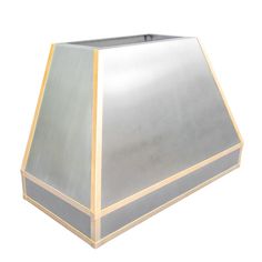 a silver and gold lamp shade on a white background