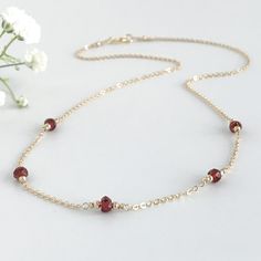 Delicate and simple, this genuine red garnet necklace is sure to become your new favorite. This necklace features your choice of 3 or 5 small genuine garnets on your choice of a sparkling 14k gold filled or sterling silver chain. You may choose a length from 15 - 20 inches. Please email me if you need another length. The recommended length for most women is 16 inches. Your new necklace will arrive in a complimentary gift box. More garnet jewelry https://www.etsy.com/shop/AustinDowntoEarth?ref=se Garnet Birthstone Necklaces For Jewelry Making, Garnet Birthstone Necklace For Jewelry Making, Garnet Necklace Gold, Red Garnet Necklace, Alexandria Va, Garnet Necklace, Dainty Gold Necklace, Garnet Jewelry, January Birthstone