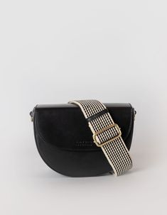 Inspired by our original Meghan bag from 2018, Ava is a modern and refined crossbody bag. The curved silhouette and firm structure make it the perfect saddle bag for street-style lovers with a luxurious touch. The half-moon shape is reminiscent of 90’s New York street style and is just as practical as is beautiful. Finished with an inside zipper pocket and magnetic closure flap, Ava makes a versatile choice for everyday wear. OMB-E163CV. DETAILS One main compartment|One interior slip-in pocket|One interior zip pocket|O My Bag's signature striped cotton lining|Leather strap: 109cm - 124cm|Webbing strap: 85cm - 130cm|Fits the webbing strap|Antique brass hardware SIZE L 23 W 8 H 16.5 cm Ava Black, Classic Leather Bag, Crossbody Saddle Bag, New York Street Style, Sustainable Leather, Antique Brass Hardware, Moon Shape, Webbing Strap, New York Street