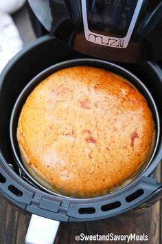 a bundt cake in an air fryer with the lid open and ready to be cooked