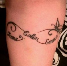 a tattoo on the leg of a woman with words written in cursive writing