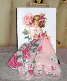 "This beautiful card is 5\" x 8:  an envelope is also included.  \"A Pretty Hanky to use as you please, Just for fun, or to cover a sneeze.\" or Mother's Day Poem The handkerchief is a brand new vintage style hanky 12\" x 12\"." Handkerchiefs Crafts, Keepsake Hanky, Vintage Handkerchiefs Crafts, Hanky Dress, Wedding Hankerchief, Handkerchief Crafts, Mothers Day Poems, Dress Card, Jane Austin