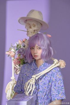 a woman with purple hair wearing a skeleton costume and holding a flower bouquet in front of her head