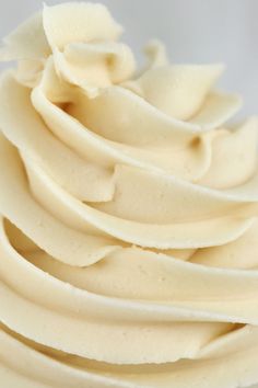 a close up view of a cupcake with white frosting