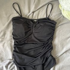 Size: Small Never Used Black Ruched Fitted Bodysuit, Black Fitted Ruched Bodysuit, Fitted Black Ruched Bodysuit, Chic Black Ruched Bodysuit, Ruched One-piece Bodysuit For Party, Summer Ruched Bodysuit For Night Out, Black Ruched Swimwear For Party, Black Ruched Party Swimwear, Black Bodysuit