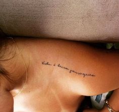 a woman with a tattoo on her back and the words, make love to someone