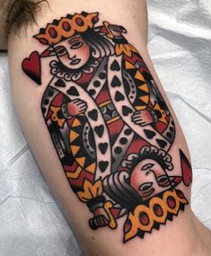 a tattoo on the leg of a person with an image of two cats and hearts