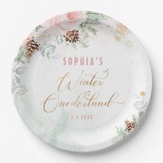 a white paper plate with gold lettering and pink flowers on it that says, sophia's winter onederland