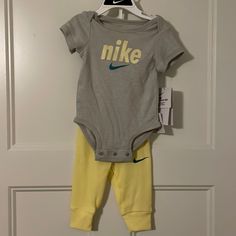 Baby Nike 2 Piece Set. Unisex. Adorable! Size 6mo. Nwt Nike Casual Onesie For Playtime, Casual Nike Onesie For Playtime, Yellow Onesie For Playwear, Yellow Cotton Onesie For Playtime, Yellow Cotton Onesie For Playwear, Yellow Cotton Playtime Onesie, Casual Yellow Onesie For Spring, Yellow Onesie For Playtime, Cute Yellow Onesie For Playwear