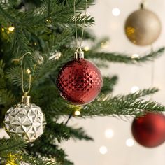 a christmas tree with ornaments hanging from it