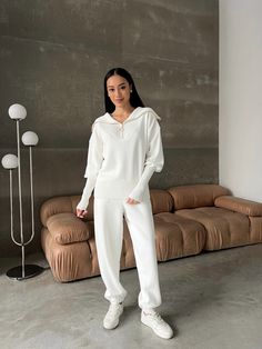 "Cozy and stylish white knitted two-piece set will keep you warm in cold weather!  Our suit is knitted on a hand-knitting machine from merino wool with the addition of cotton, pleasant to the touch and consists of a zip neck pullover with high cuffs and jogger pants with pockets.  The sweater and trousers can be worn separately, combined with other things and getting a lot of new interesting looks.   DETAILS - white - 70% merino, 30% cotton  - loose fit  - high cuff sleeve - zip neck - drop shoulder line - jogger pants - pockets - warm  - cozy      SIZES   This suit is available in 3 sizes XS-S and M-L, XL-XXL  Sweater:  Back length 21.25\"/ 54 cm  dropped sleeve 21.65\"/ 55 cm  Shoulder 10.23\"/ 26 cm  Pants:  inseam length 26.77\"/ 68 cm outseam length 40.15\"/ 102 cm   Size  XS - S  bus Women's Pantsuit, Trendy Bottoms, Knit Two Piece Set, Womens Knit Sweater, Knitted Suit, Pantsuits For Women, Pants With Pockets, Fitted Suit, Oversized Pullover