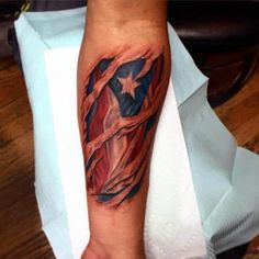 a man's arm with an american flag tattoo on it