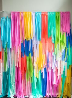 the colorful streamers are hanging on the wall