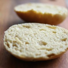 two pieces of bread sitting on top of a wooden cutting board