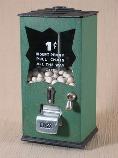 a green machine with white balls in it's front and the words insert penny all chain are out