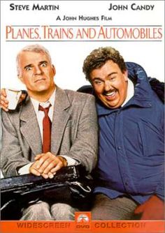 two men sitting on a bench in front of a movie poster for planes, trains and automobiles