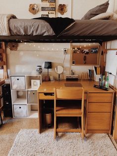 a loft bed with desk underneath it