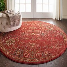 a large red rug in front of a window