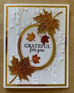 a card with some leaves on it and the words grateful for you written in gold