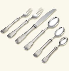 an assortment of silverware with spoons and knives