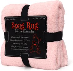 a pink blanket with a black tag on the front and back of it that says, squig rug