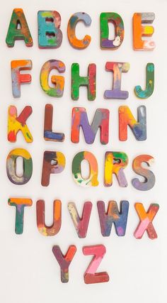 the letters and numbers are made out of colorful plastic blocks with different colors on them